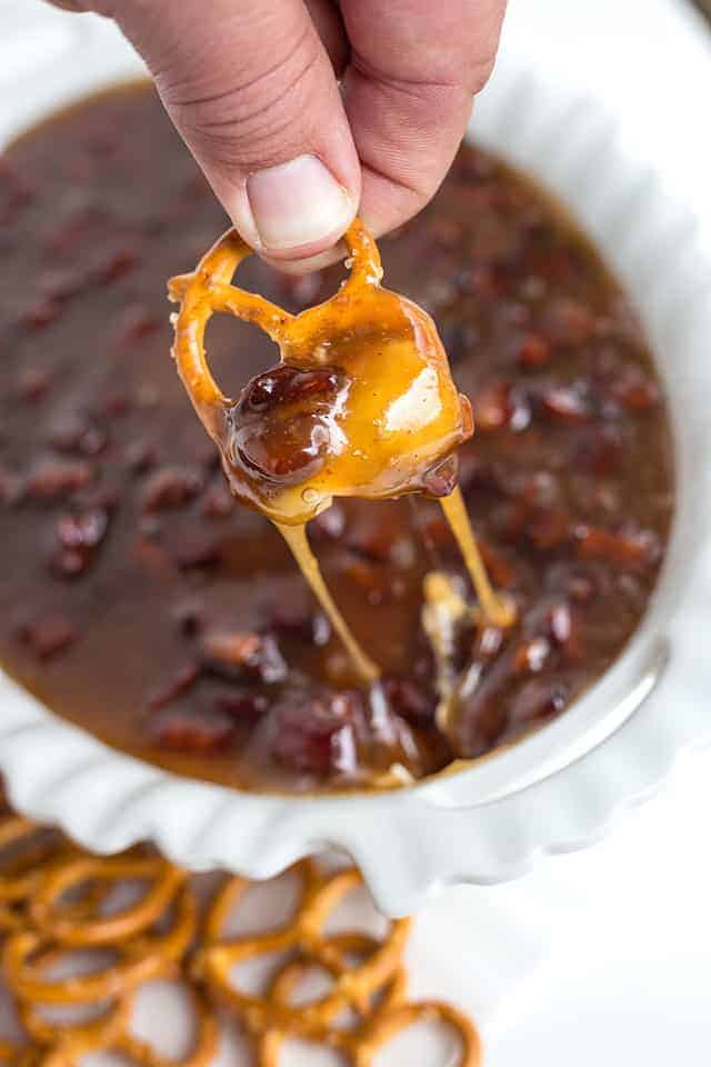 pretzel dipped in maple bacon sugar cookie dip