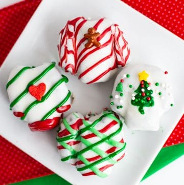 Ugly Sweater OREO Cookie Balls on a white plate with red and green fabric