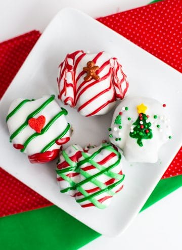 Ugly Sweater OREO Cookie Balls on a white plate with red and green fabric