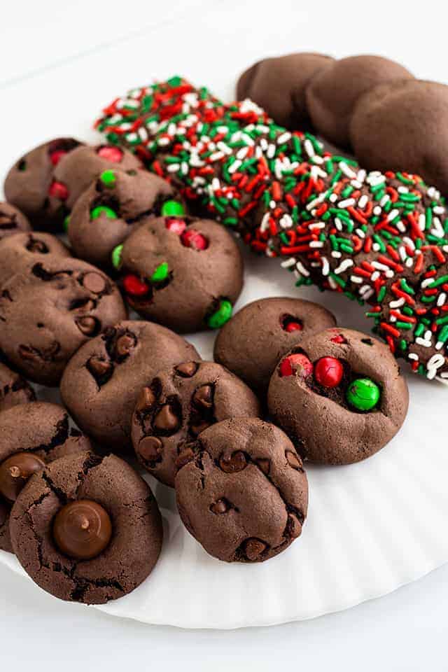 All of the chocolate cake mix cookies on a white plate