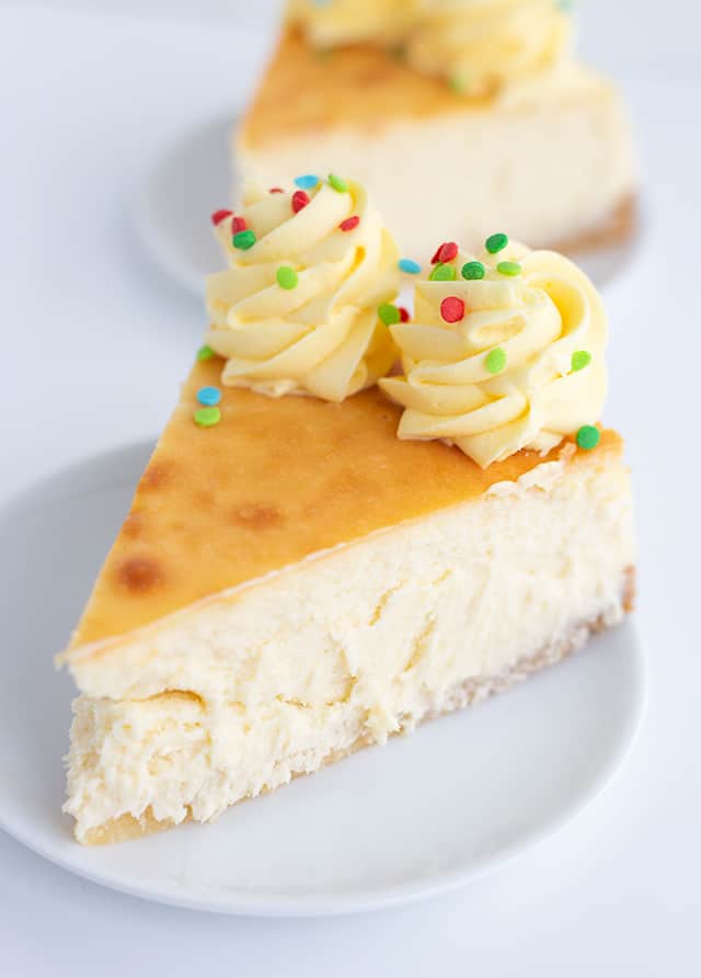 Sugar Cookie Cheesecake - This sugar cookie cheesecake is the perfect Christmas dessert. It has a sugar cookie crust, a cheesecake filled with sugar cookie mix and a sugar cookie coffee creamer, and a whipped cream frosting made with pudding. #sugarcookie #cheesecake #christmas #christmasdessert #sugarcookies #whippedcream #frosting