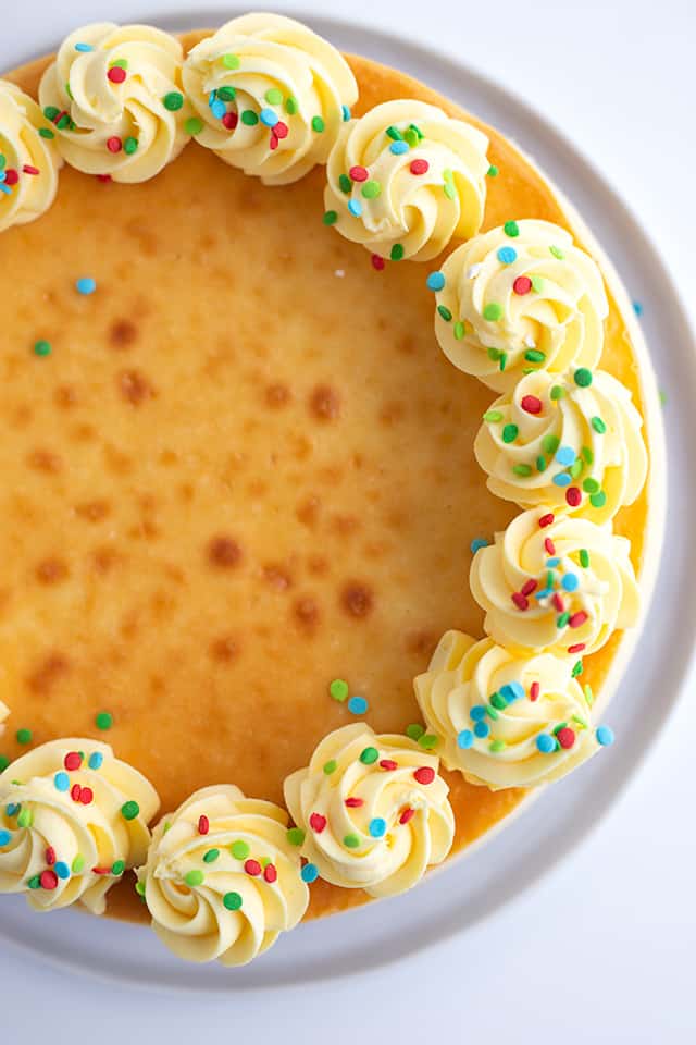 Sugar Cookie Cheesecake - This sugar cookie cheesecake is the perfect Christmas dessert. It has a sugar cookie crust, a cheesecake filled with sugar cookie mix and a sugar cookie coffee creamer, and a whipped cream frosting made with pudding. #sugarcookie #cheesecake #christmas #christmasdessert #sugarcookies #whippedcream #frosting