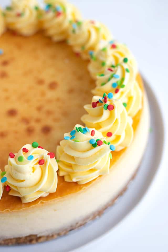 Sugar Cookie Cheesecake - This sugar cookie cheesecake is the perfect Christmas dessert. It has a sugar cookie crust, a cheesecake filled with sugar cookie mix and a sugar cookie coffee creamer, and a whipped cream frosting made with pudding. #sugarcookie #cheesecake #christmas #christmasdessert #sugarcookies #whippedcream #frosting