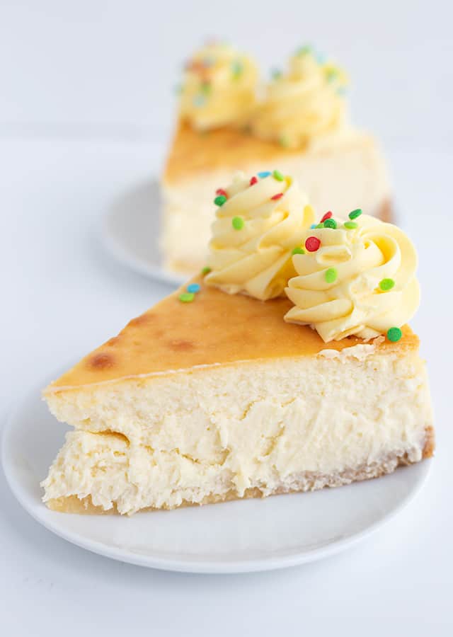Sugar Cookie Cheesecake - This sugar cookie cheesecake is the perfect Christmas dessert. It has a sugar cookie crust, a cheesecake filled with sugar cookie mix and a sugar cookie coffee creamer, and a whipped cream frosting made with pudding. #sugarcookie #cheesecake #christmas #christmasdessert #sugarcookies #whippedcream #frosting