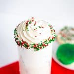 sprinkle rimmed sugar cookie cocktail with whipped cream