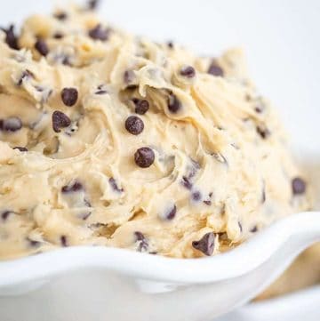 Chocolate chip cookie dough dip in a white bowl.