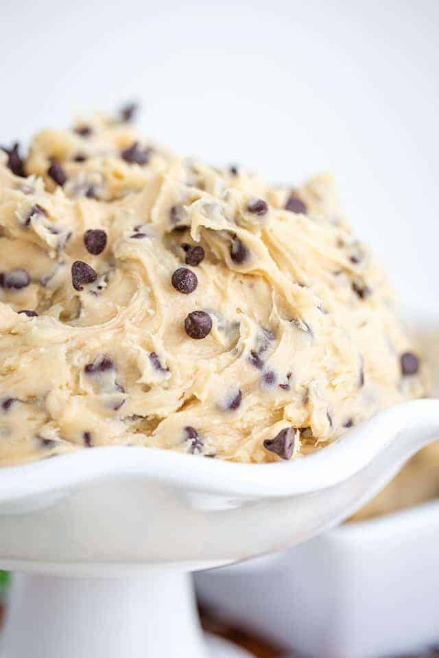 Chocolate chip cookie dough dip in a white bowl.