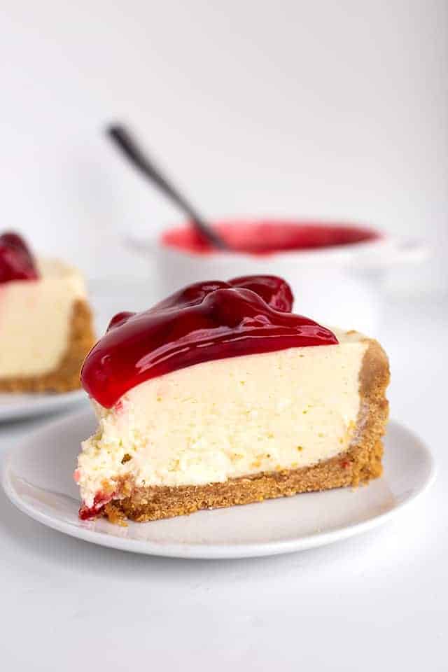 slice of instant pot cheesecake on a white plate