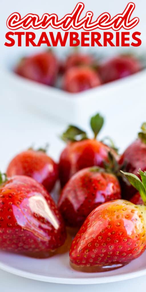 Candied strawberries presented on a white plate.