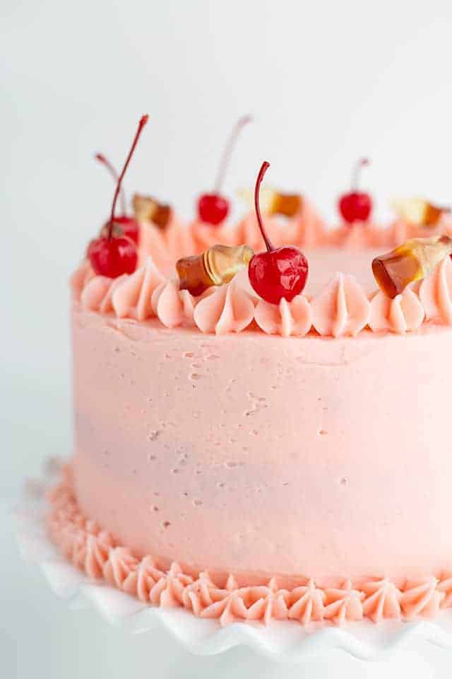 A Cherry Cola cake with cherries on top.