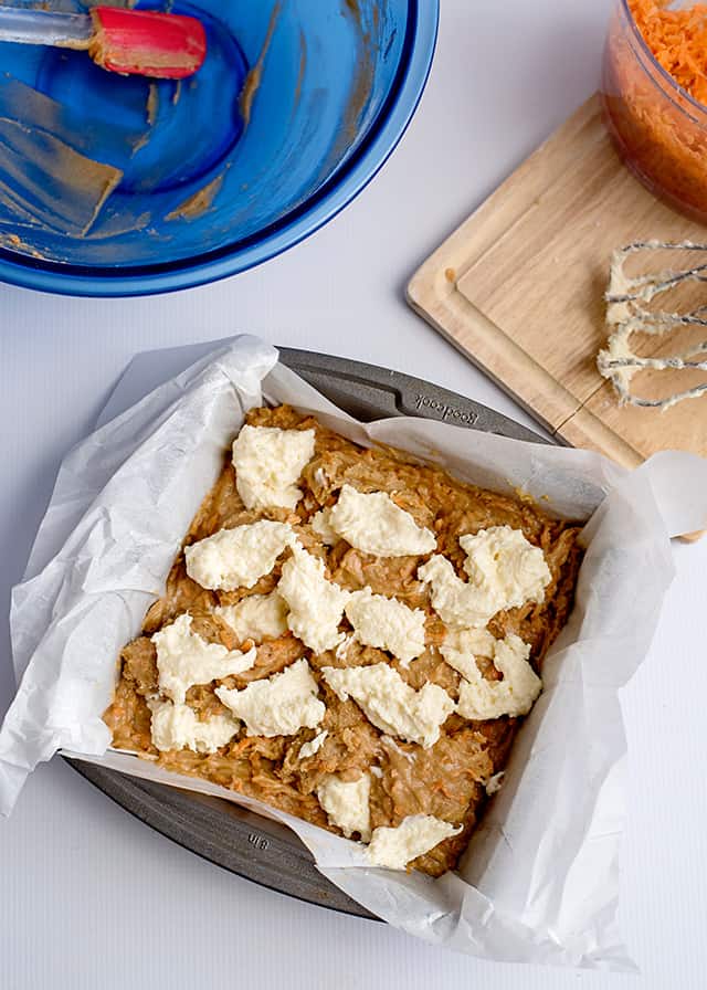 cream cheese dollops in baking pan