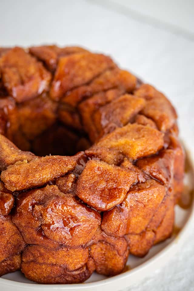Instant Pot Monkey Bread - This Instant Pot Monkey Bread is so easy to make and tastes amazing! This monkey bread (Instant Pot) is one of my very favorites. Each piece of biscuit is coated in cinnamon and sugar before being added to the bundt pan. #cookiedoughandovenmitt #instantpot #instantpotrecipes #instantpotdesserts #instantpot #monkeybread #dessertfoodrecipes #dessertrecipes monkey bread close up view