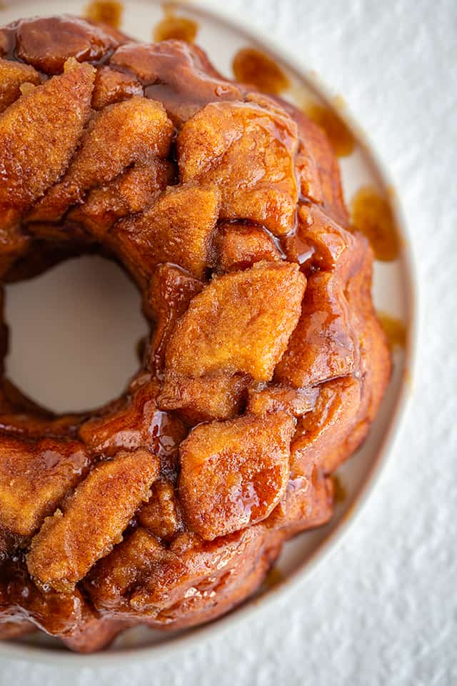 Instant Pot Monkey Bread - This Instant Pot Monkey Bread is so easy to make and tastes amazing! This monkey bread (Instant Pot) is one of my very favorites. Each piece of biscuit is coated in cinnamon and sugar before being added to the bundt pan. #cookiedoughandovenmitt #instantpot #instantpotrecipes #instantpotdesserts #instantpot #monkeybread #dessertfoodrecipes #dessertrecipes monkey bread close up overhead view