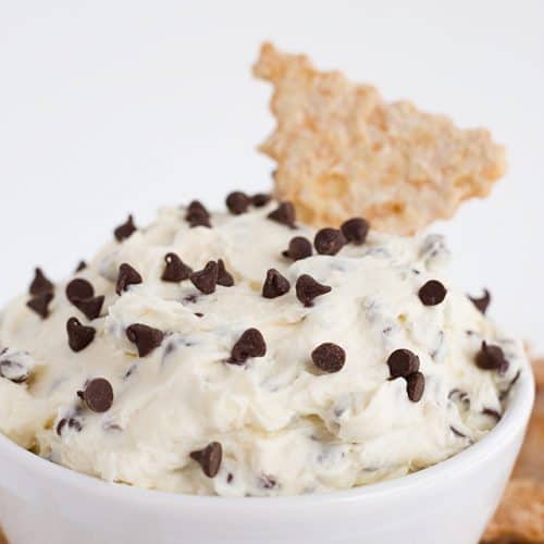 white bowl filled with cannoli dip and mini chocolate chips