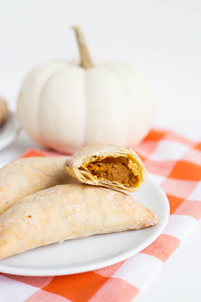 Pumpkin Pasties - These Harry Potter Pumpkin Pasties are perfect for this cool, fall weather. You're probably thinking, those are Pumpkin Hand Pies and you're not wrong! Each pie is stuffed with a pumpkin pie filling, baked to perfection, then dipped in maple cinnamon glaze! If you're looking for an easy pumpkin pasties recipe, you've found it! #cookiedoughandovenmitt #HarryPotter #pumpkinsdesserts #pumpkinrecipes #fallrecipes #falldesserts