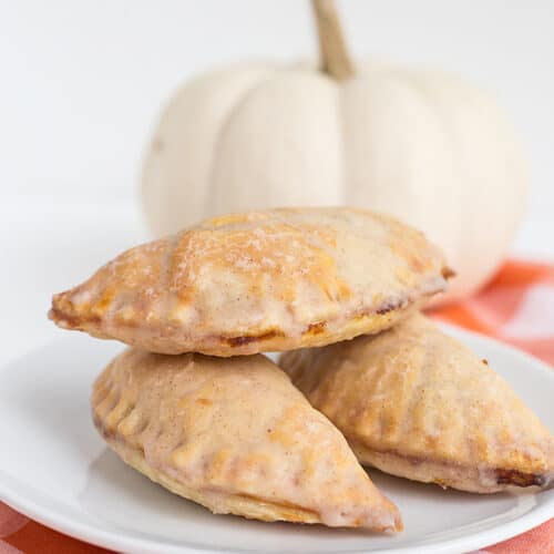 pumpkin pasties stacked on white plate