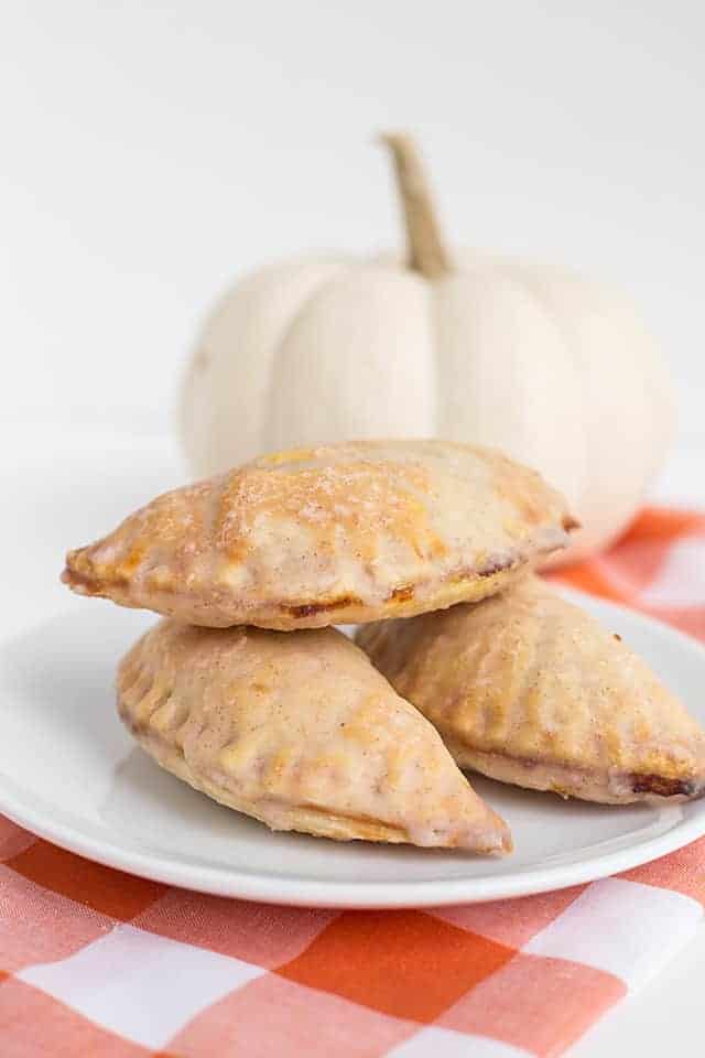 pumpkin pasties stacked on white plate