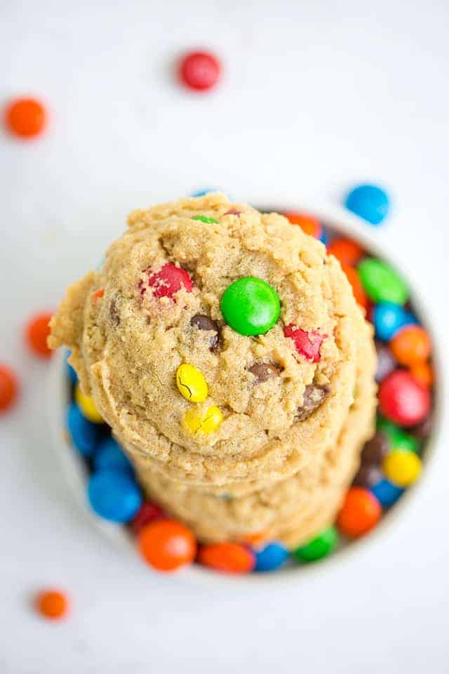 overhead photo of monster cookies sitting on M&M's