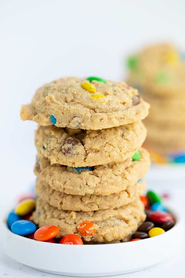 monster cookies stacked in a small white plate