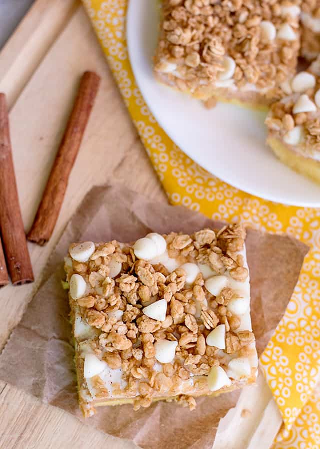 slice of sweet potato cheesecake bars on brown paper