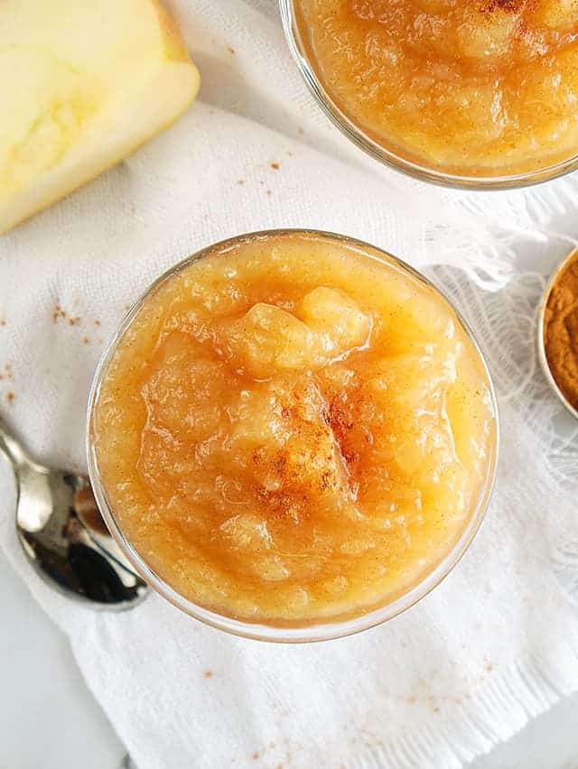 overhead photo of instant pot applesauce with a white linen and spoon