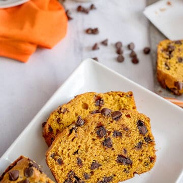 two slices of pumpkin chocolate chip bread on a plate