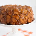 close up of monkey bread on a white cake plate