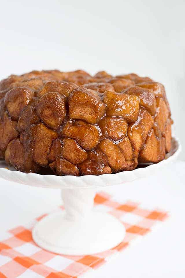 close up of monkey bread on a white cake plate