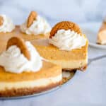 serving a slice of double layer pumpkin cheesecake