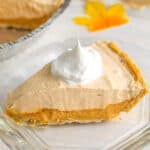 slice of pumpkin ice cream pie on a glass plate