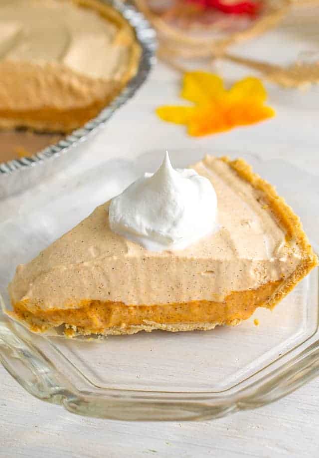 slice of pumpkin ice cream pie on a glass plate