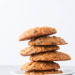 a staggered stack of pumpkin oatmeal chocolate chip cookies
