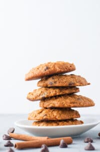a staggered stack of pumpkin oatmeal chocolate chip cookies