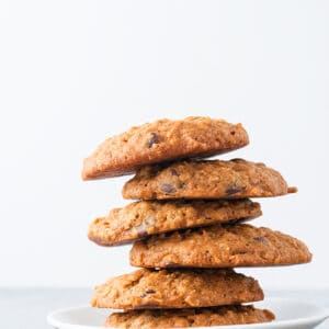 a staggered stack of pumpkin oatmeal chocolate chip cookies