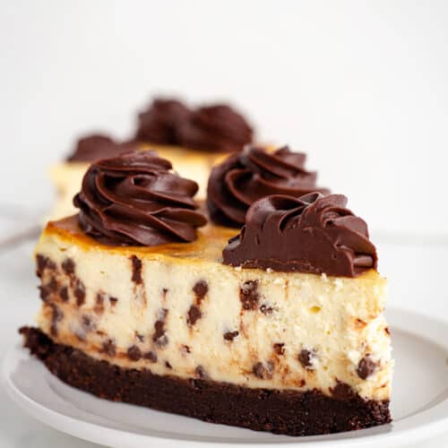 slice of brownie chocolate cheesecake on white plate