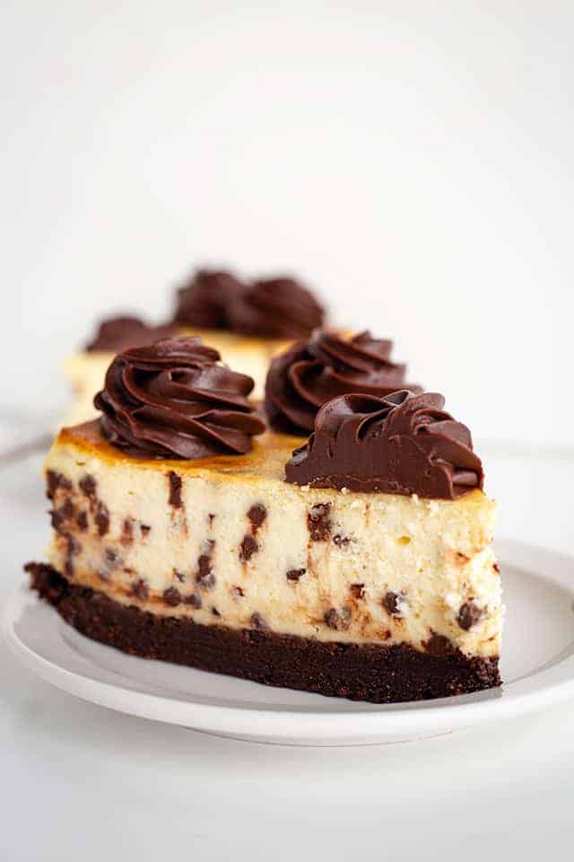 slice of brownie chocolate cheesecake on white plate