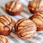 front of buckeye brownie bites on a striped linen