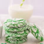 A stack of St. Patrick's Day Cookies with a glass of milk