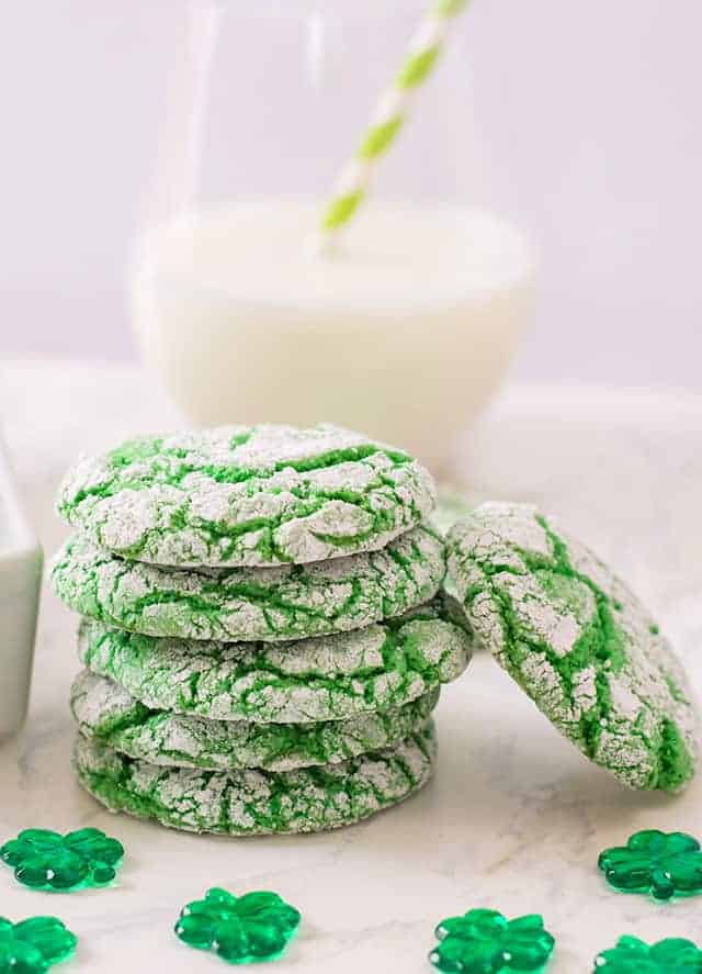 A stack of St. Patrick's Day Cookies with a glass of milk