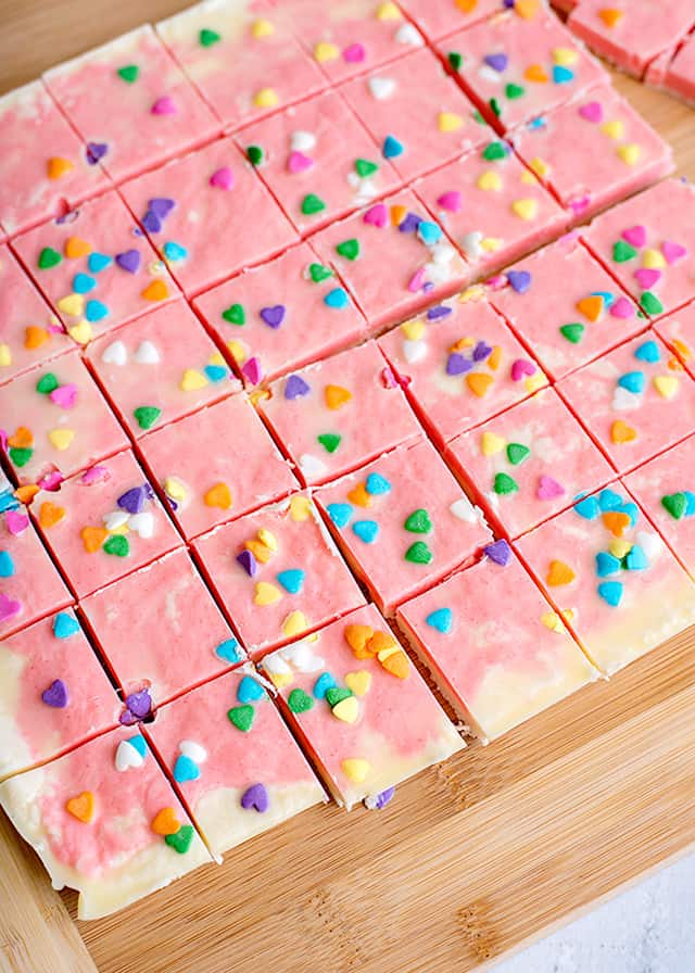 strawberry fudge cut up on a cutting board