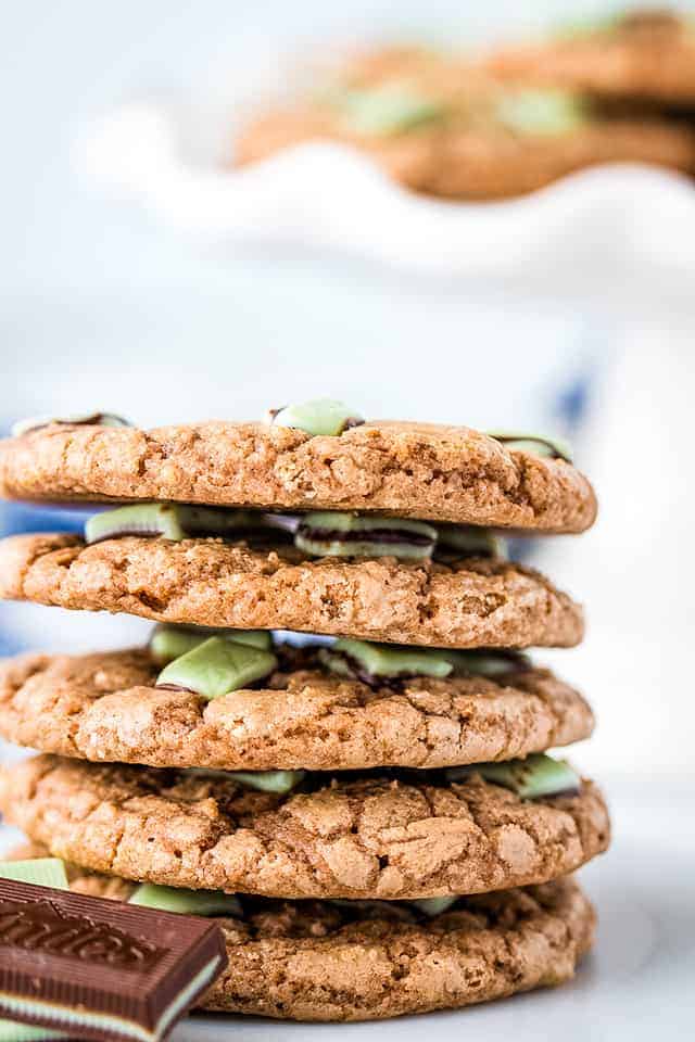 Andes mint cookies stacked on a plate with Andes mints