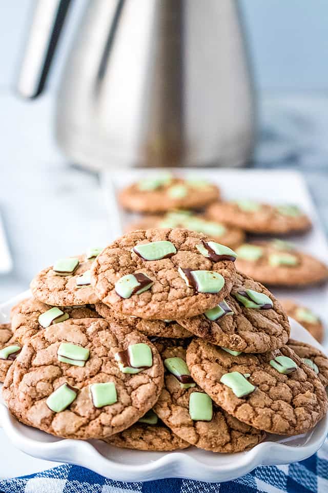 pile of chocolate mint cookies on a scalloped plate