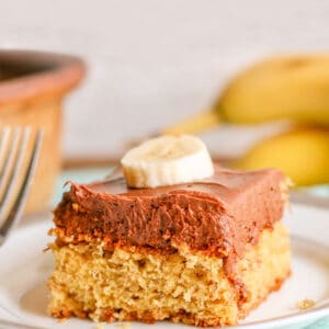 slice of banana cake with chocolate frosting