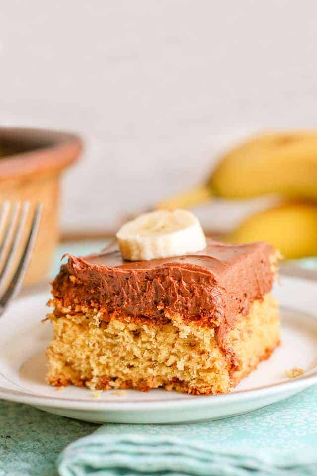 slice of banana cake with chocolate frosting