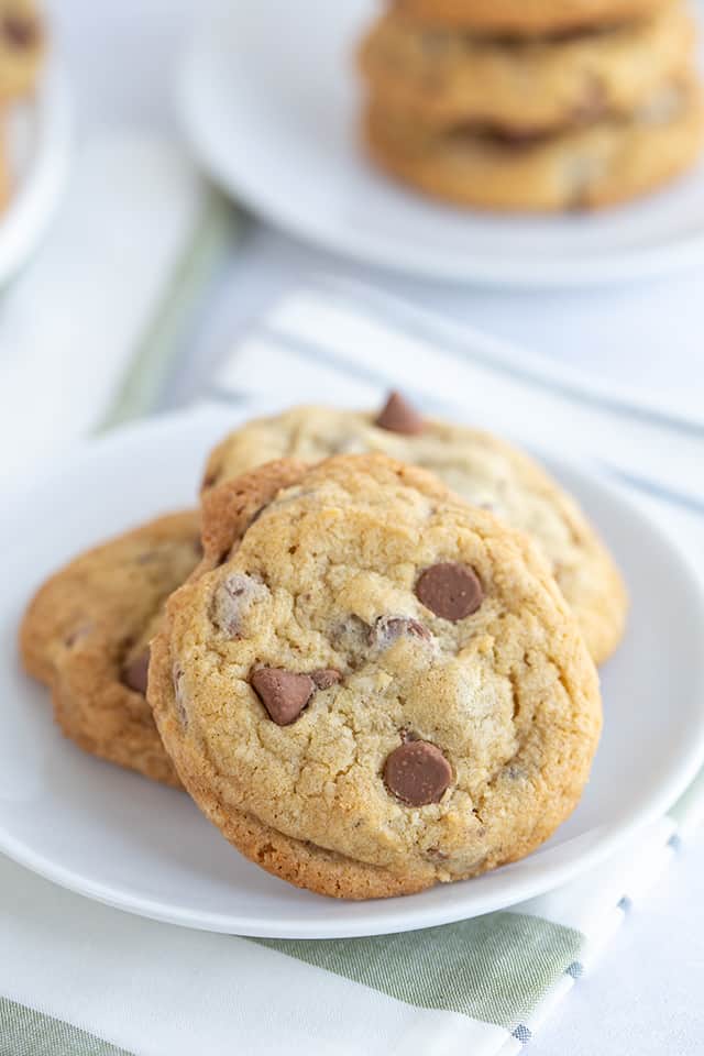 chocolate chip cookie propped up on white plate