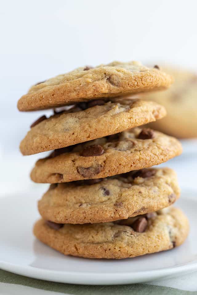 chocolate chip cookies stacked on a dessert plate