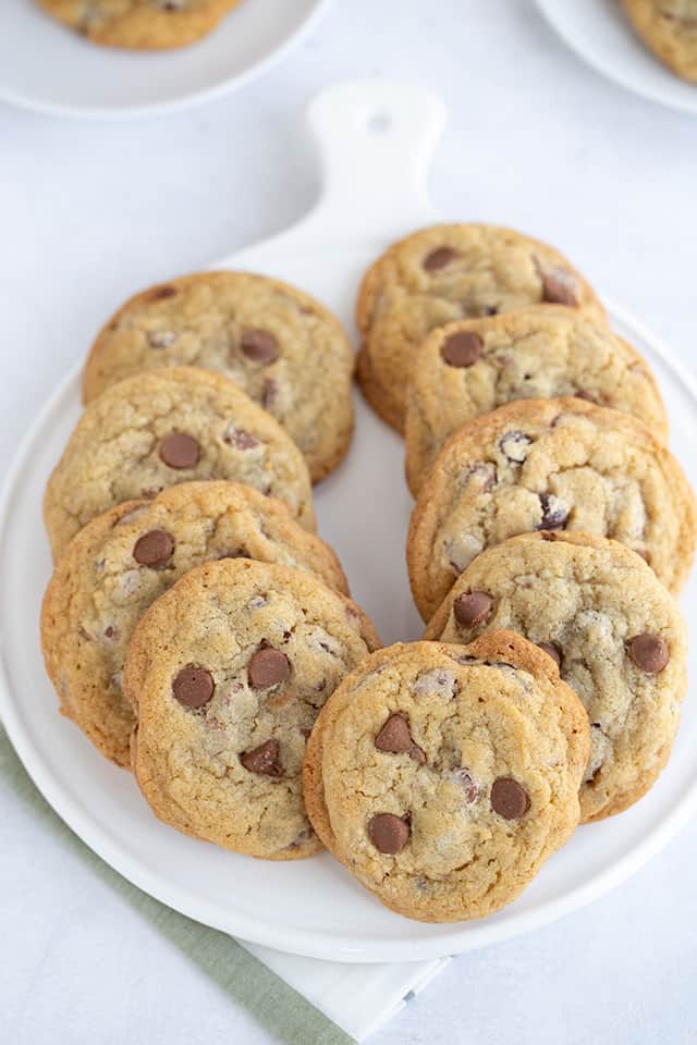 chocolate chip cookies lined up on a white platter