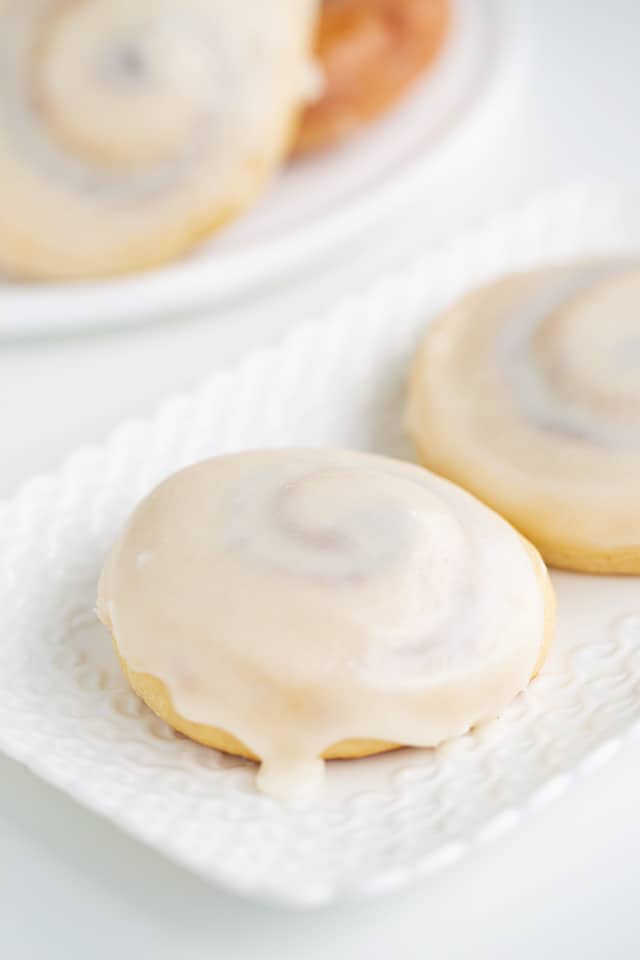 glazed honey buns on a white rectangle plate