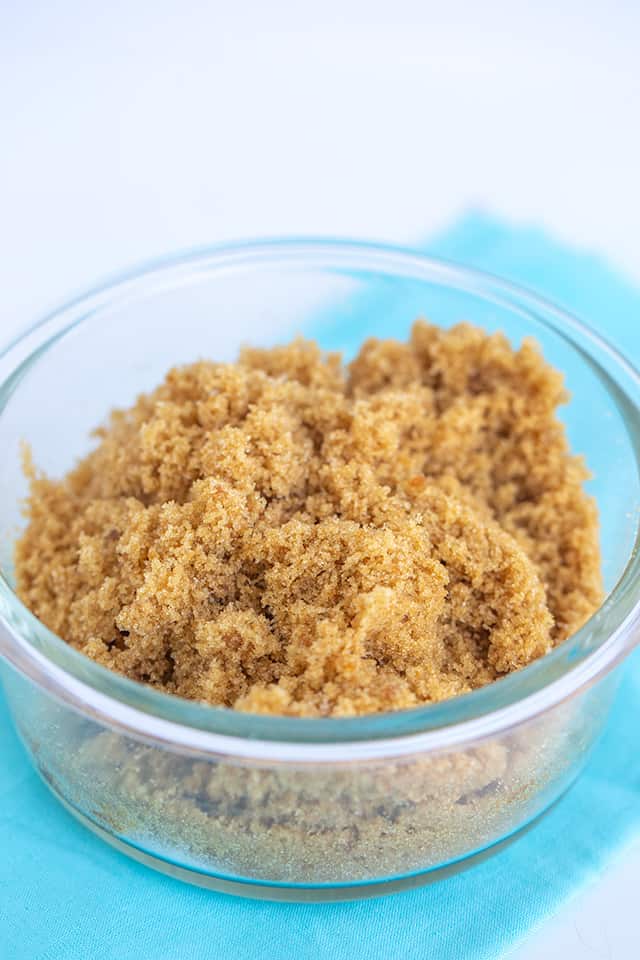 a bowl of homemade brown sugar with a blue fabric