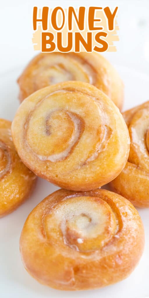 Honey buns displayed on a pristine plate.